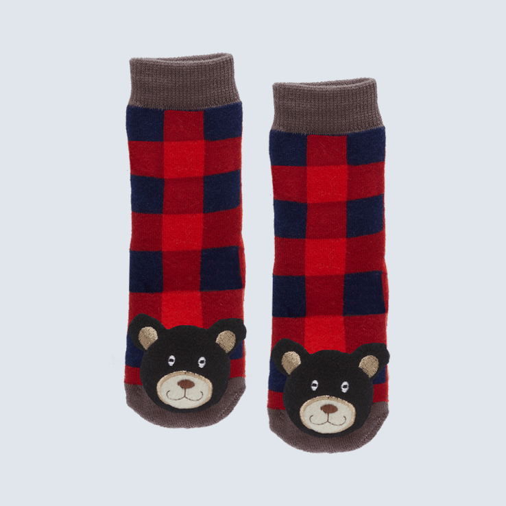 Two plaid socks against a white background. The socks feature a maple leaf and wood motifs. Each toe features a cute plush black bear.