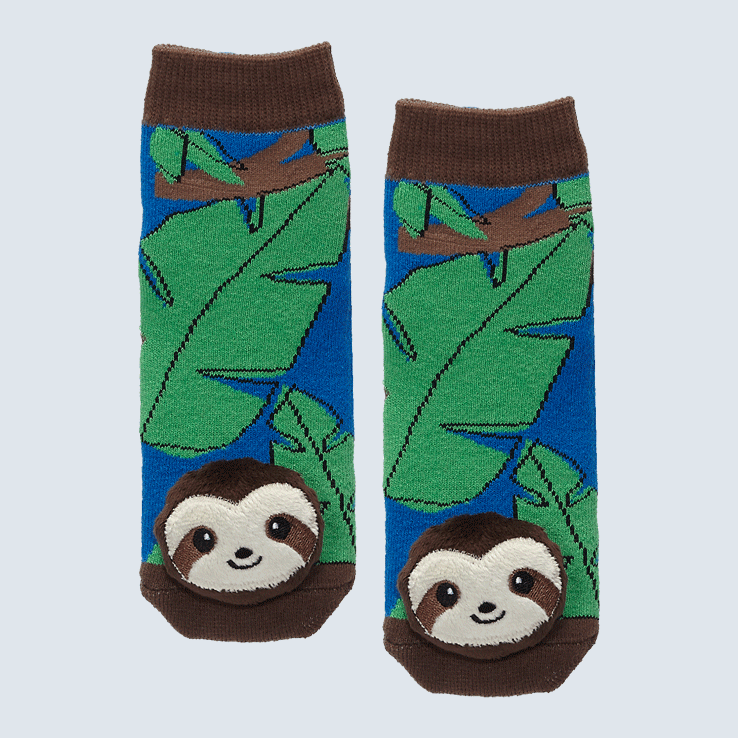 Two socks against a white background. The socks feature a leaf motif and a cute plush sloth charm on the toe.